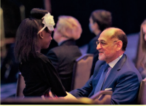 Dr. HM Hashemian, Chair of the ANS Honors and Awards Committee greeting Cali Foster (great-granddaughter of OR85 student Ernestine Avery) at the American Nuclear Society Winter Meeting in Washington D.C. on December 6, 2022. (photo: Justin Cox, ANS)